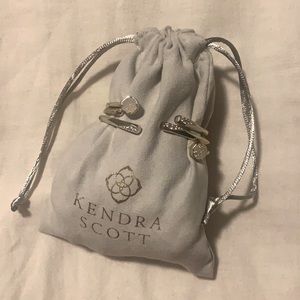 Three gold Kendra Scott bracelets